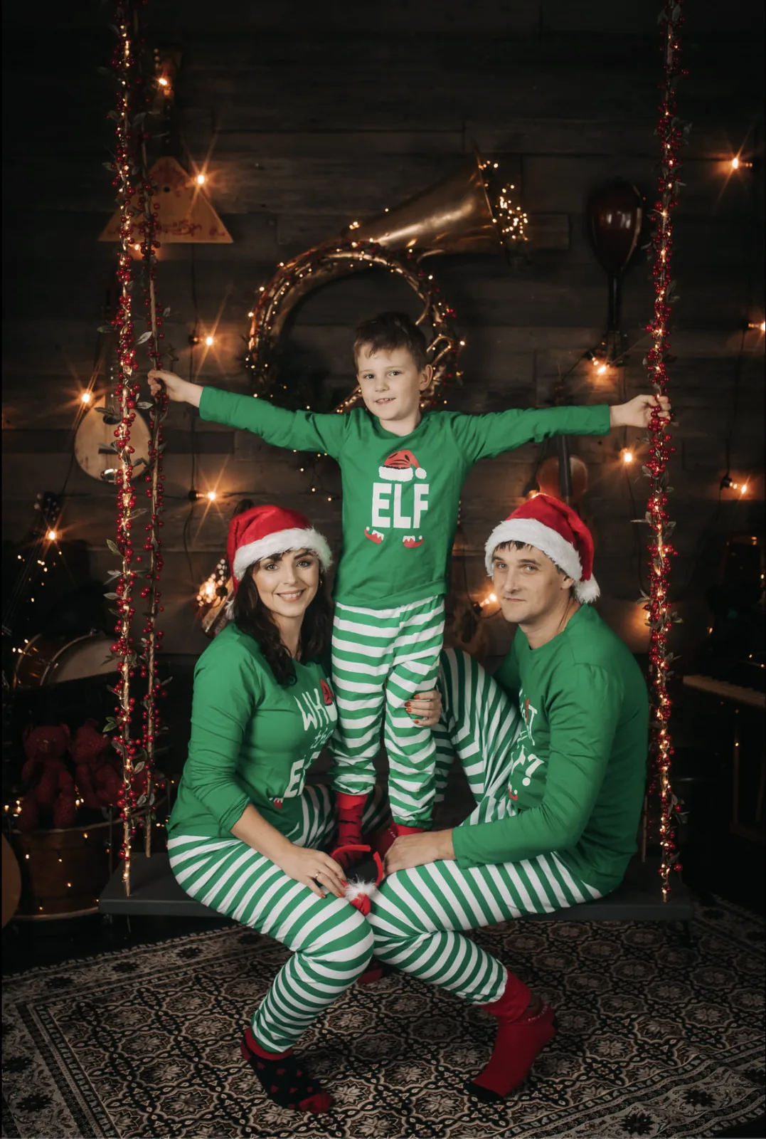A family in elf pyjamas and Santa hats in Merle Värv's Christmas studio; an example of the photographer's earlier work